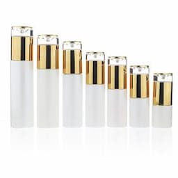 Wholesale Luxury skin care white cosmetic glass lotion bottle and glass cream jar with gold cap